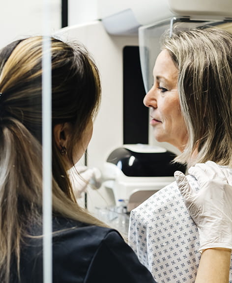 female patient preparing for a mammogram