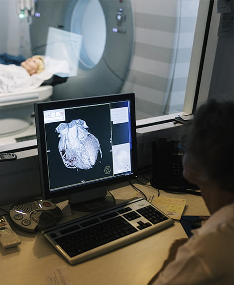 health care professional reviewing cardiac imaging